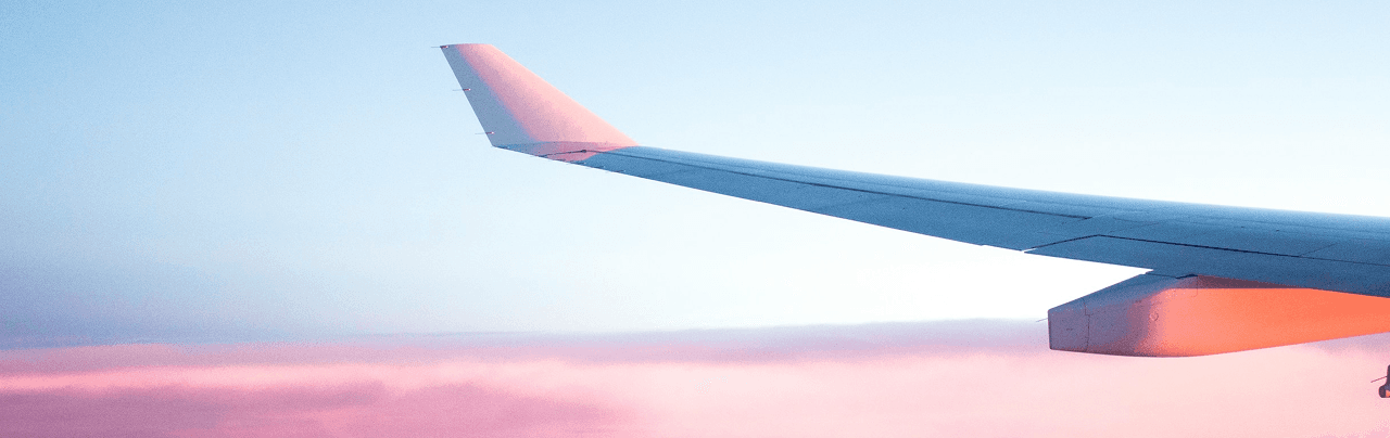 Airplane wing at sunset